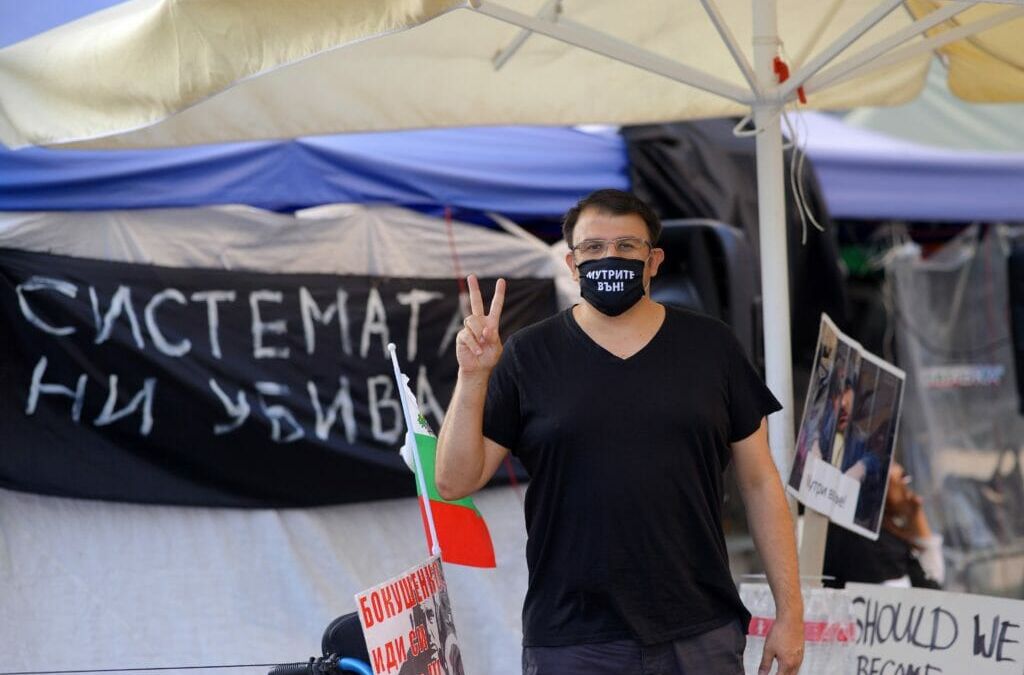 “Mafia out” is written on the mask that Ananiev wears to the protests — and also from time to time outside of them.